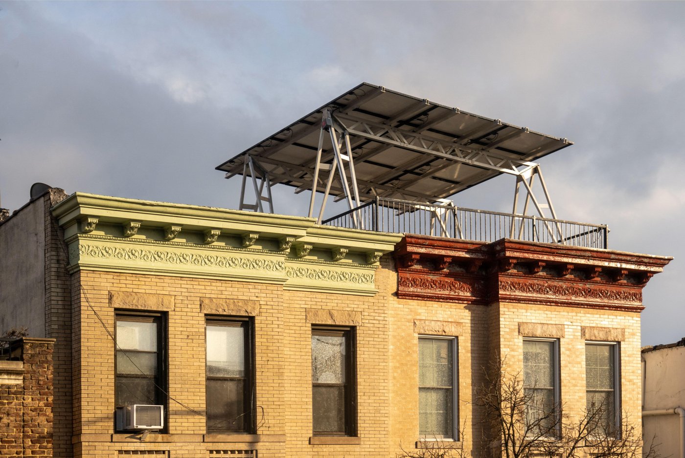 Ballasted solar array on a multi-family rowhouse rooftop deck