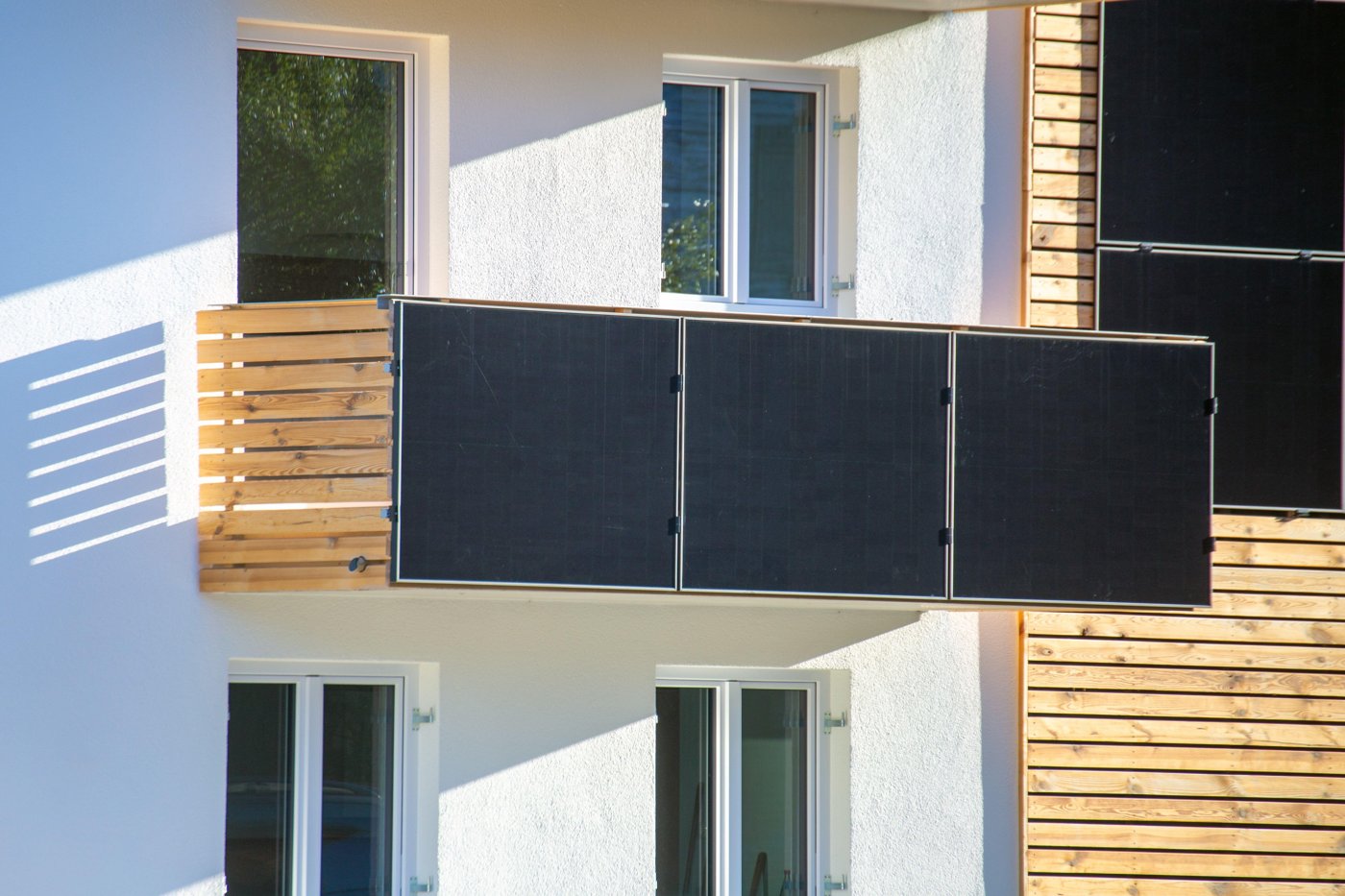 Balcony solar panels folded onto a railing like shutters