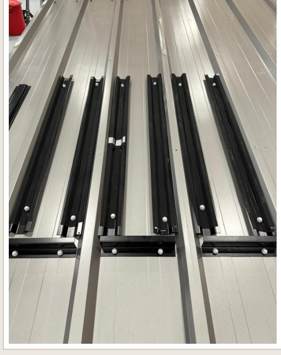 Inverted hat rails installed vertically on the wall panel