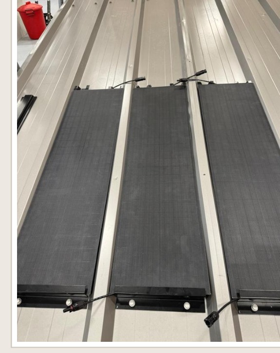 Solar collectors seated between the rails on the wall panel